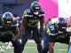 Emanuel Wilson in Seattle Seahawks uniform before a snap against the Chargers, featured in the Week 5 fantasy football waiver wire and FAAB report